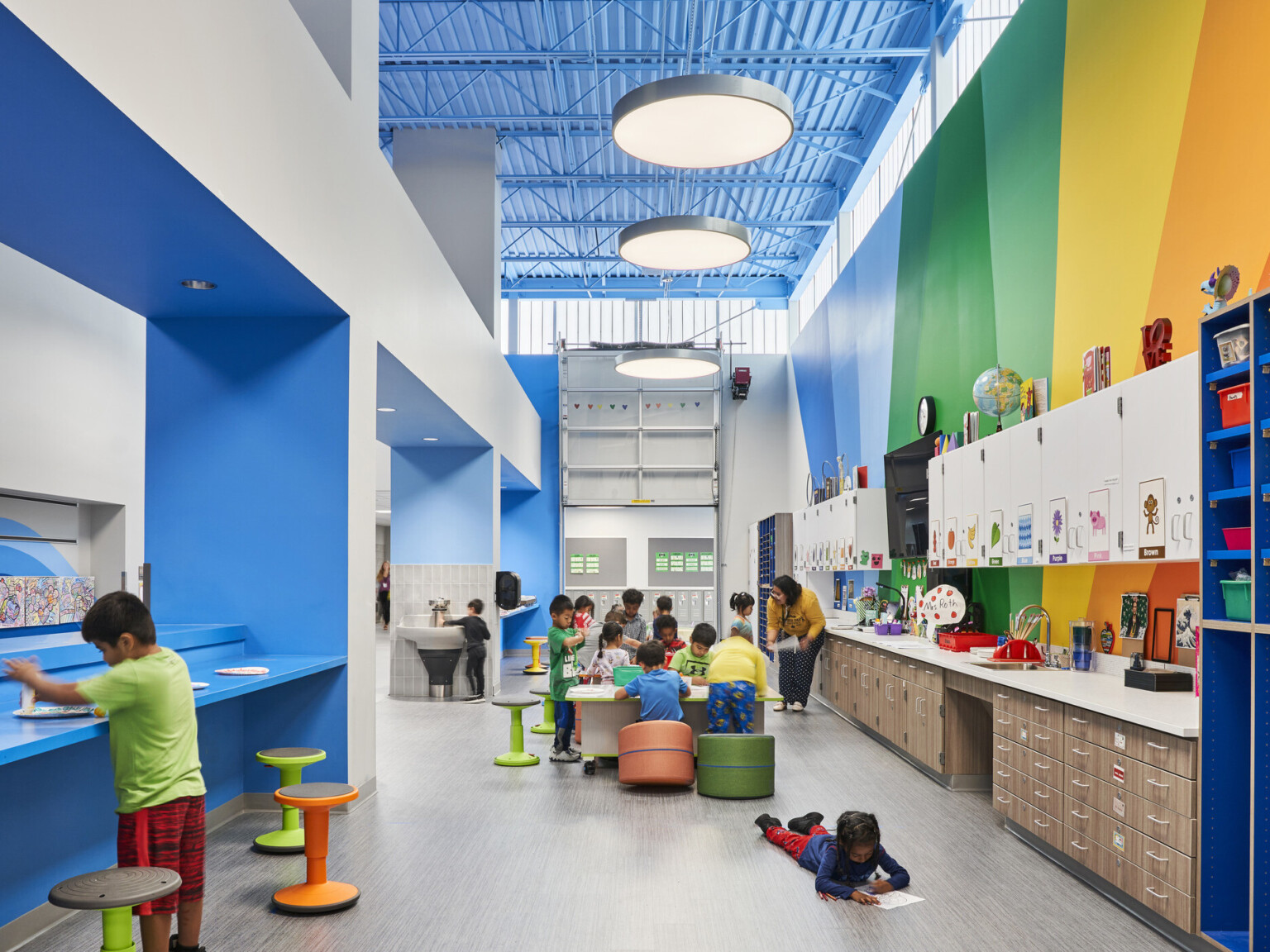 A lively classroom filled with colorful walls and furniture, creating a visually appealing environment