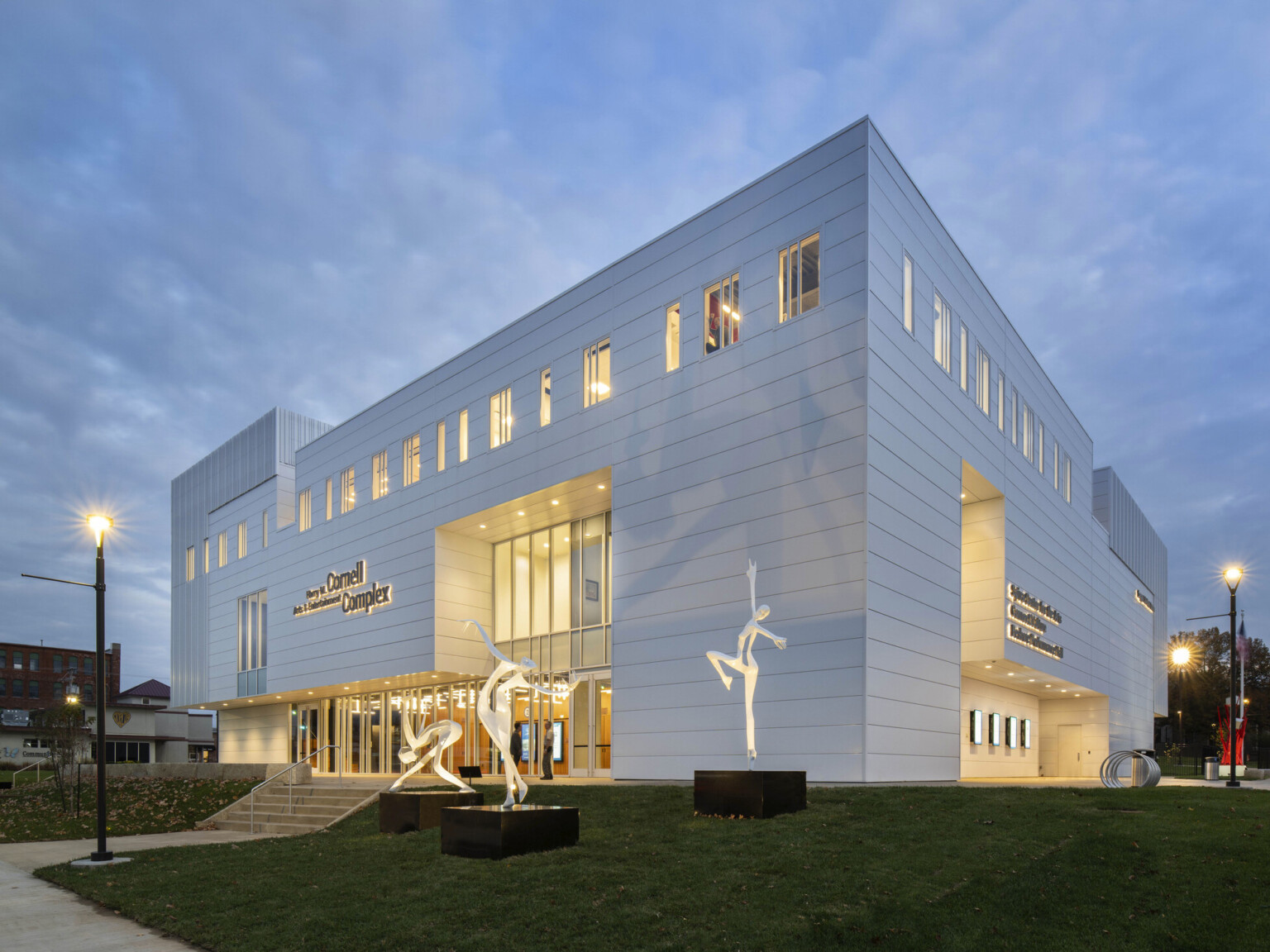 The Harry M. Cornell Arts and Entertainment Complex, a white building with recess glass, view to double height atrium