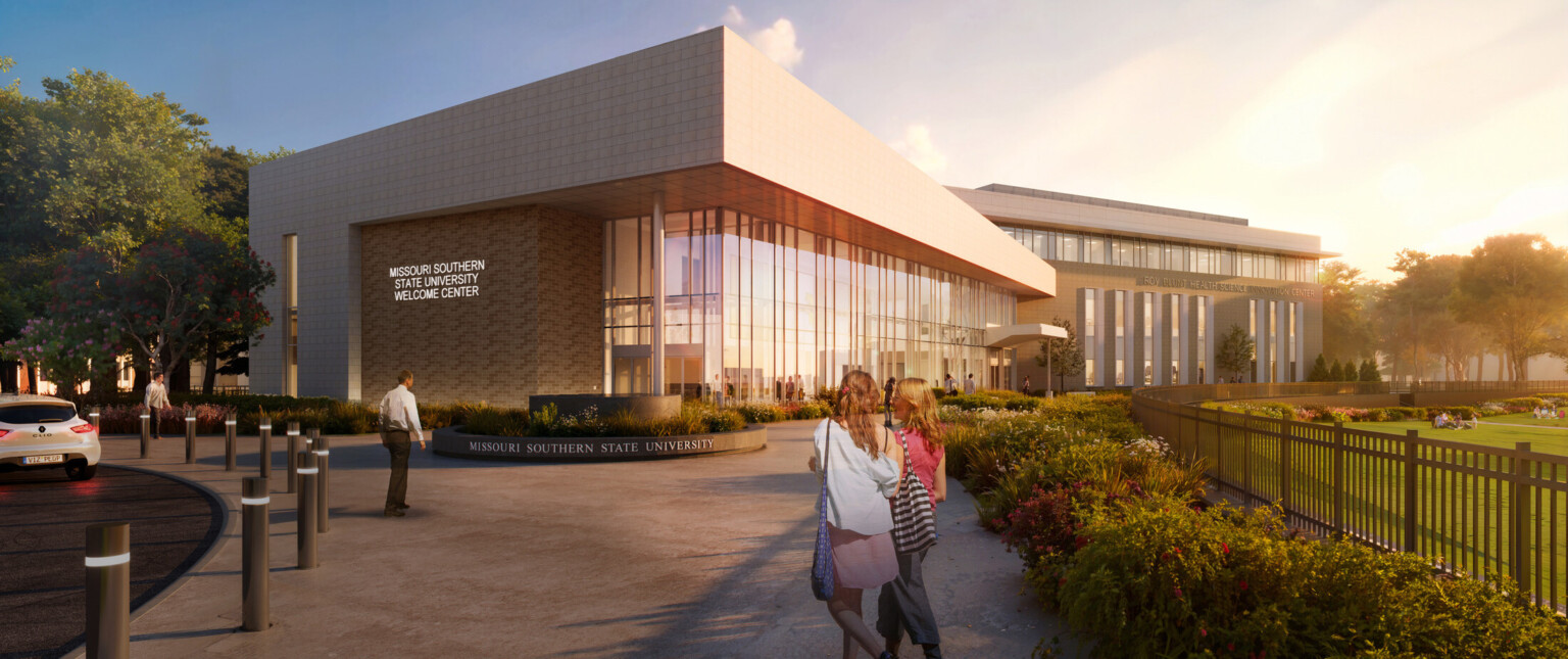 Modern university building with sleek glass walls and warm stone exteriors, labeled Missouri Southern State University Welcome Center.