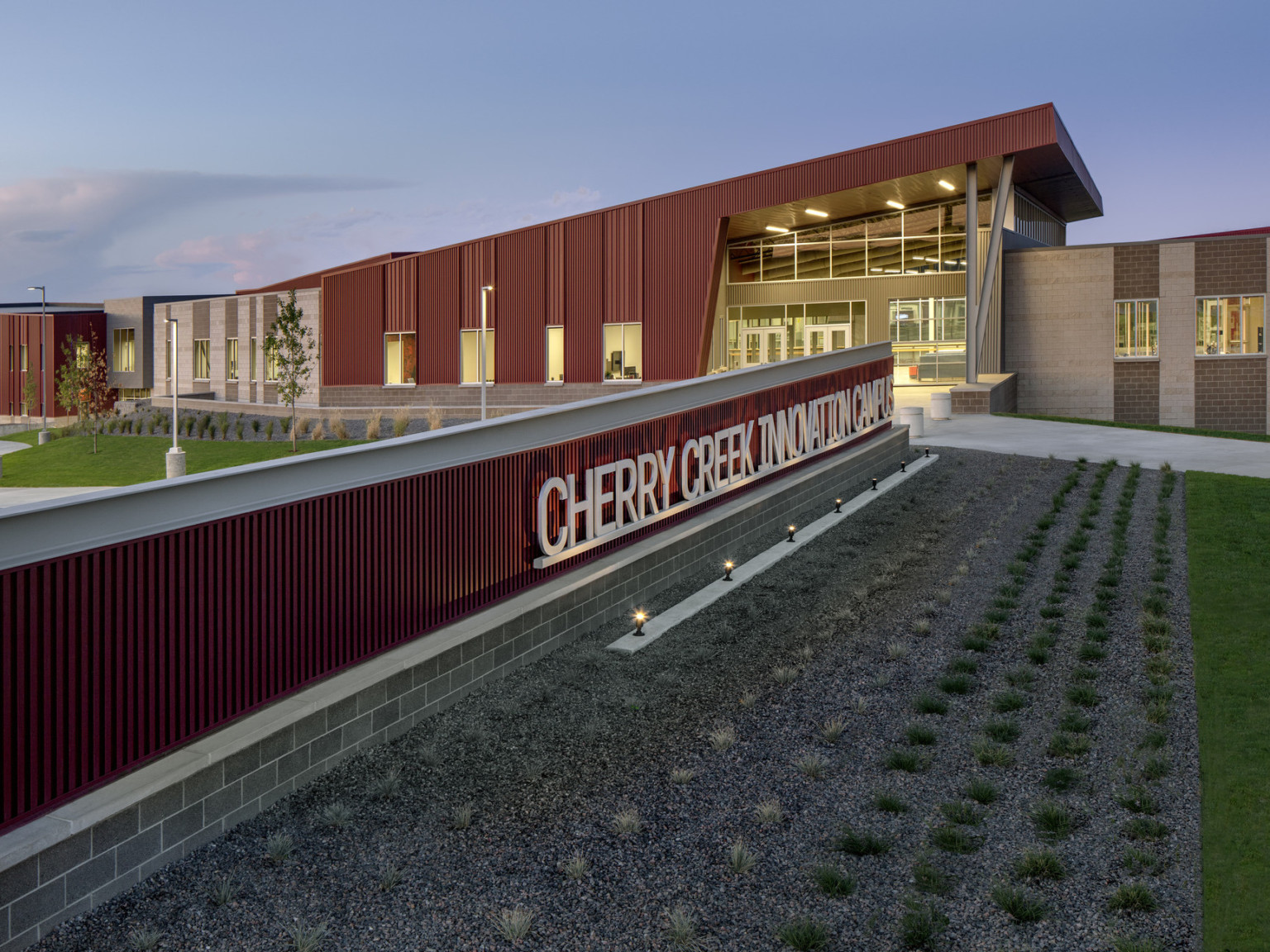 Cherry Creek Career and Innovation Academy Campus entrance, a red panel building with long sign and canopy over glass entry, ccic Colorado, cherry creek news, school bond referendum