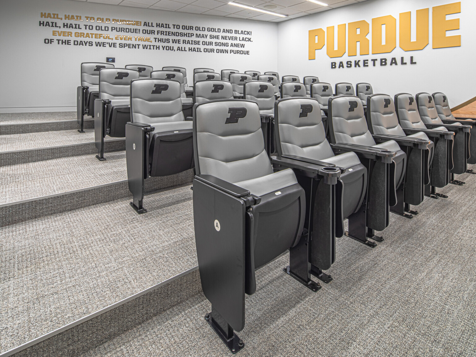 Purdue basketball auditorium showing multiple levels of grey seats with Purdue Basketball in large letters on the far wall