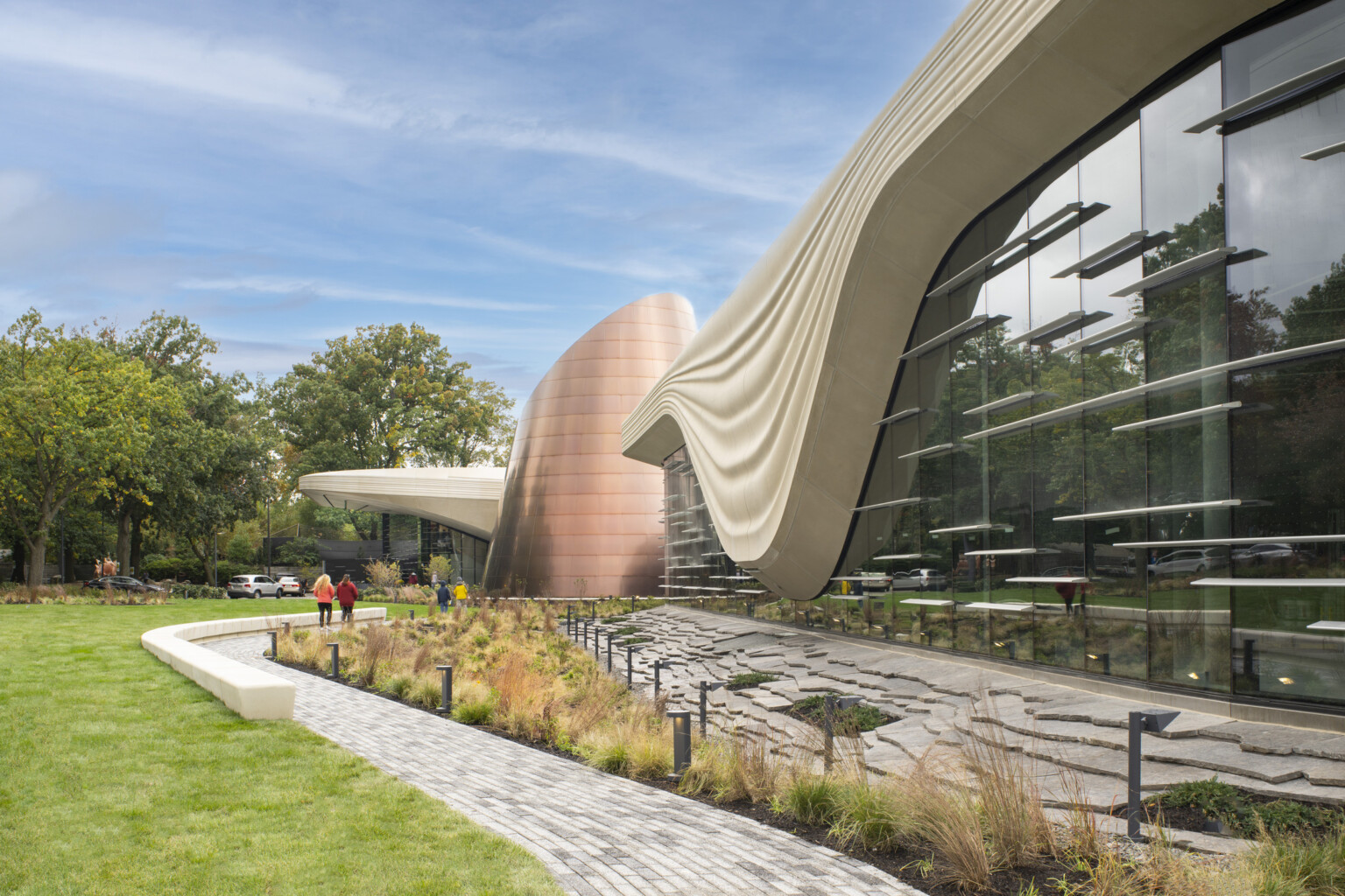 Exterior of the Cleveland Museum of Natural History showing lush grass and large window