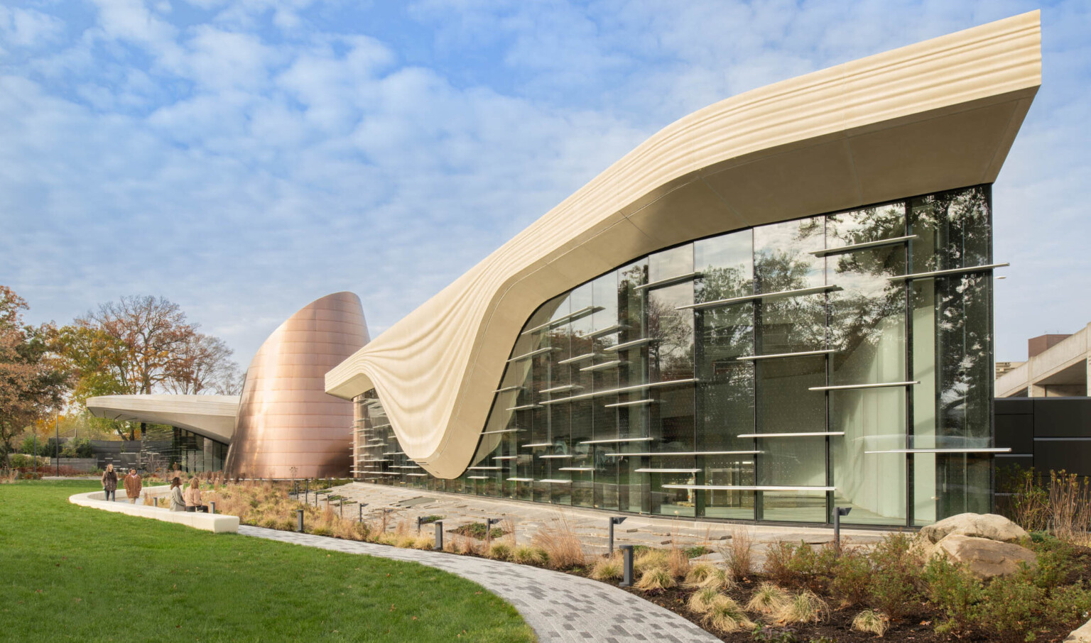 Exterior of the Cleveland Museum of Natural History showing lush grass and large window