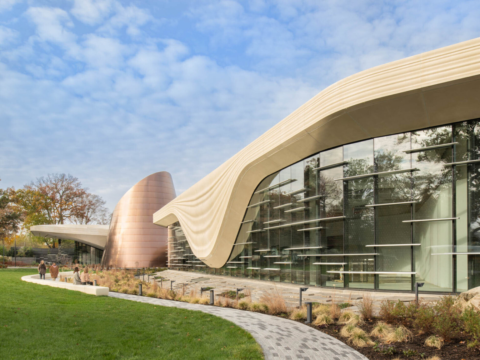 Exterior of the Cleveland Museum of Natural History showing lush grass and large window