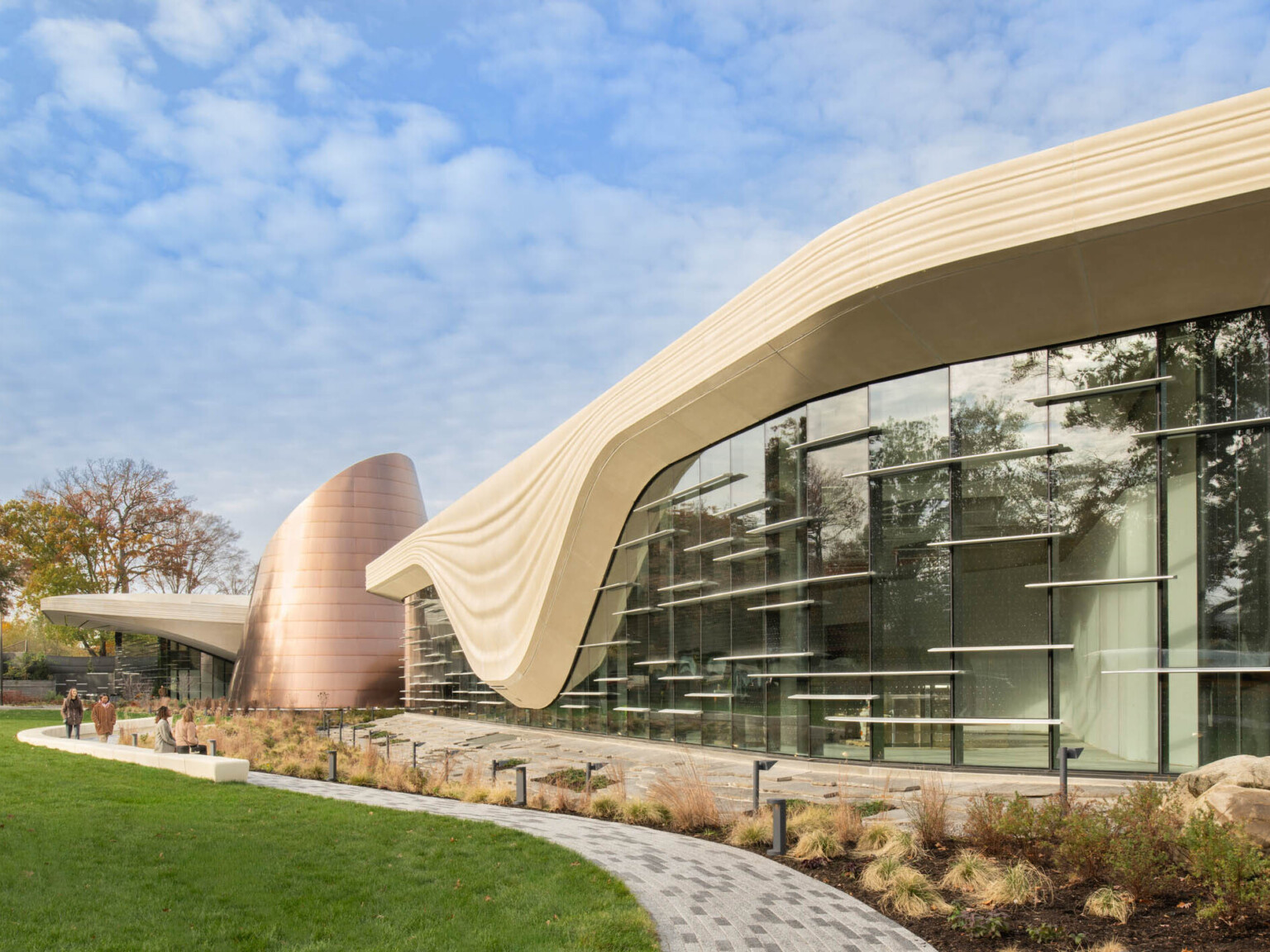 Exterior of the Cleveland Museum of Natural History showing lush grass and large window