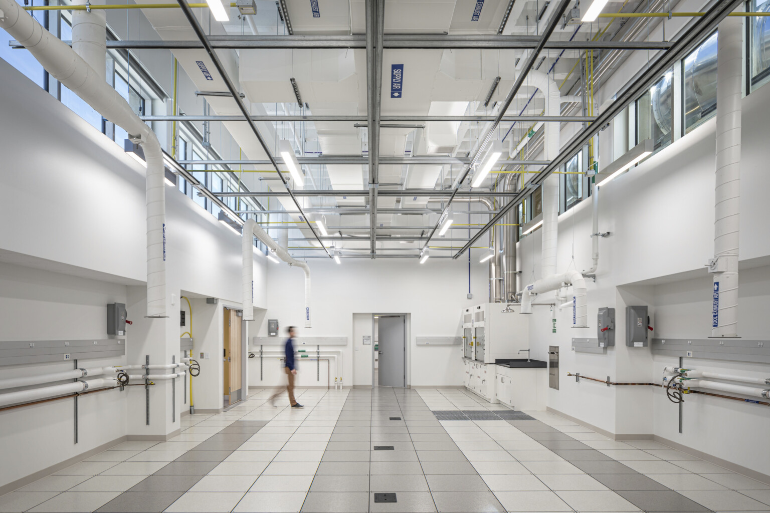 Crisp white clean lab space in National Institute of Standards and Technology overhead lighting and suport systems