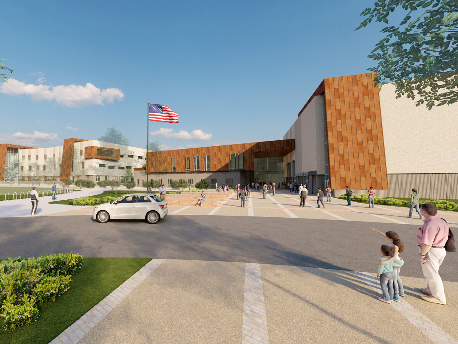 Rendering of a multistory high school with brown brick and white accents with a flag pole out front