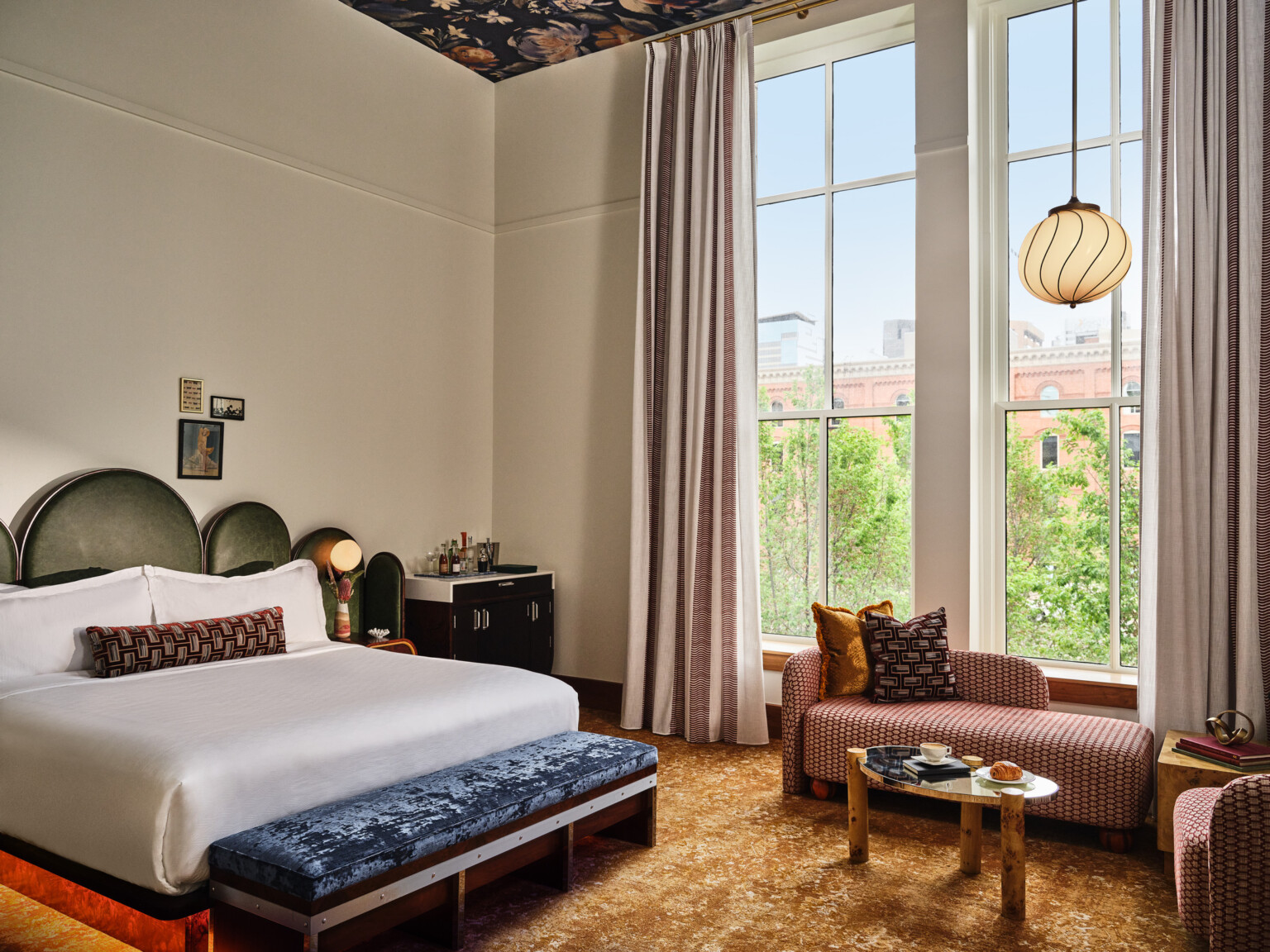 boutique hotel room at the Crawford Hotel at Denver Union Station, lush textures on benches, couches, headboard, and modernist interior design