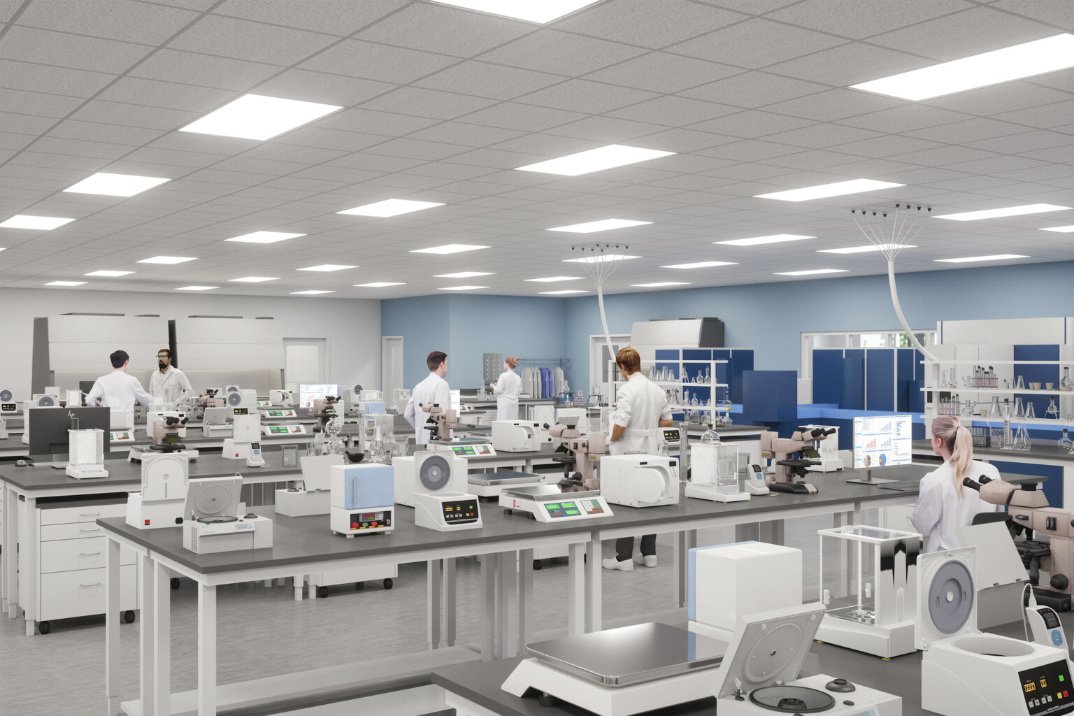 College lab classroom filled with equipment on grey tables with light blue walls in the background