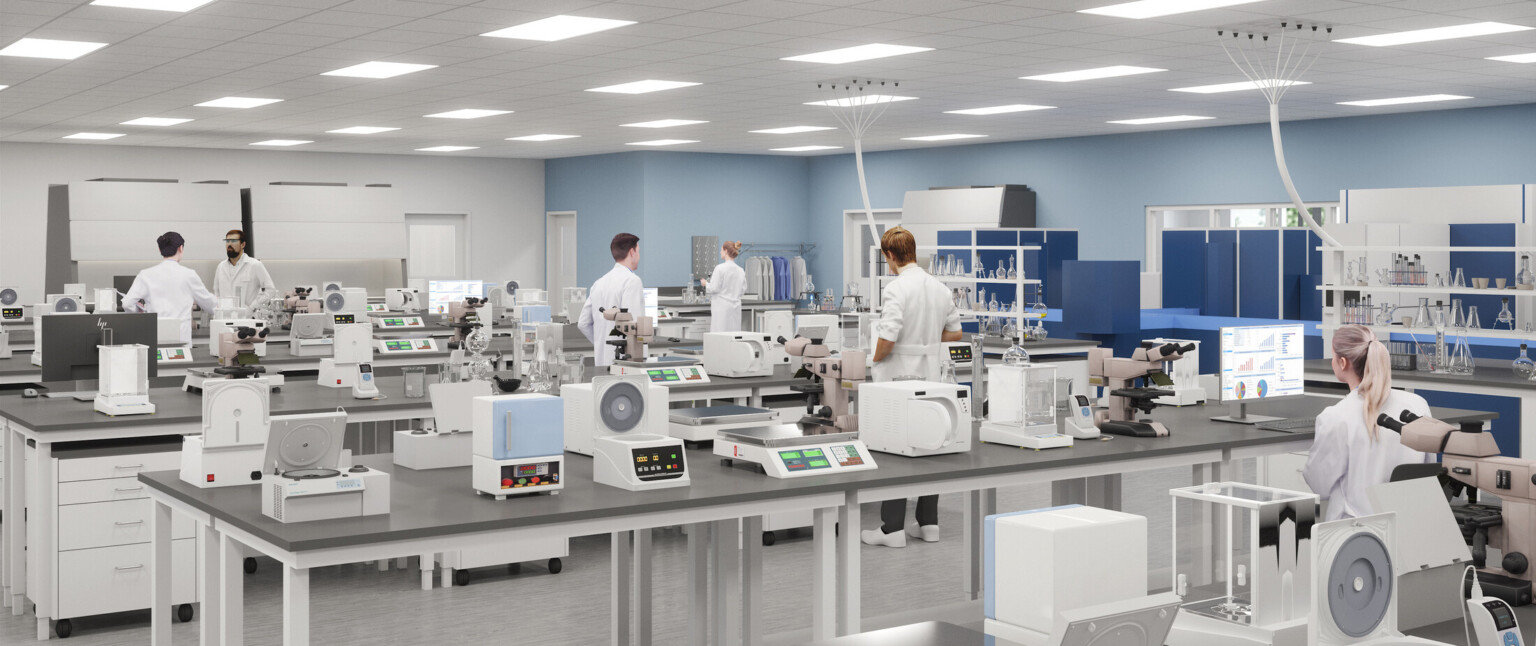 College lab classroom filled with equipment on grey tables with light blue walls in the background