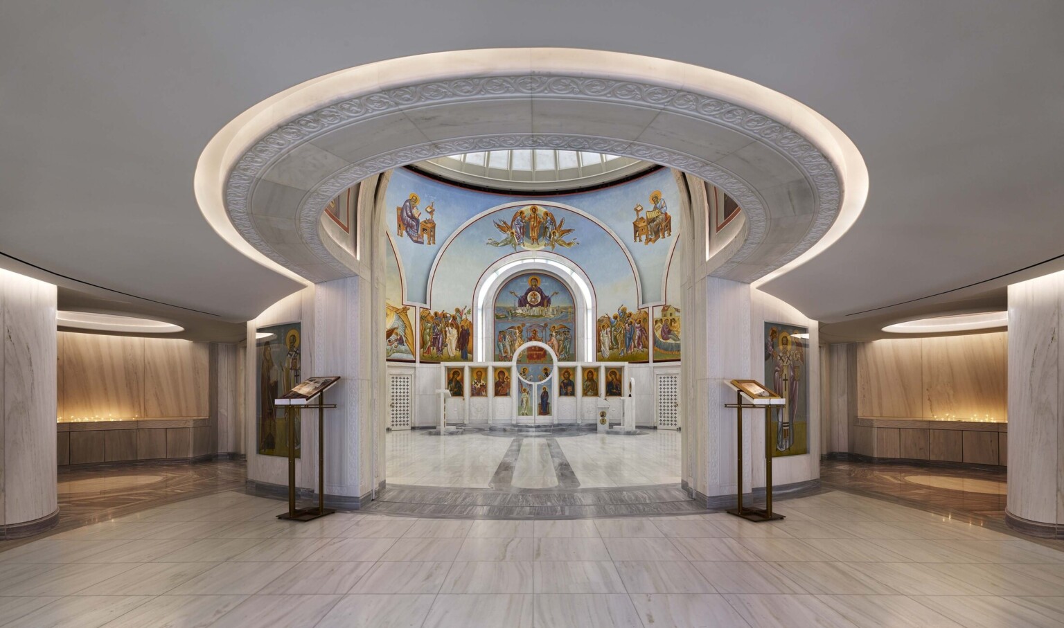 Interior view of the Saint Nicholas Greek Orthodox Church in New York City showcasing lighting and intricate painting