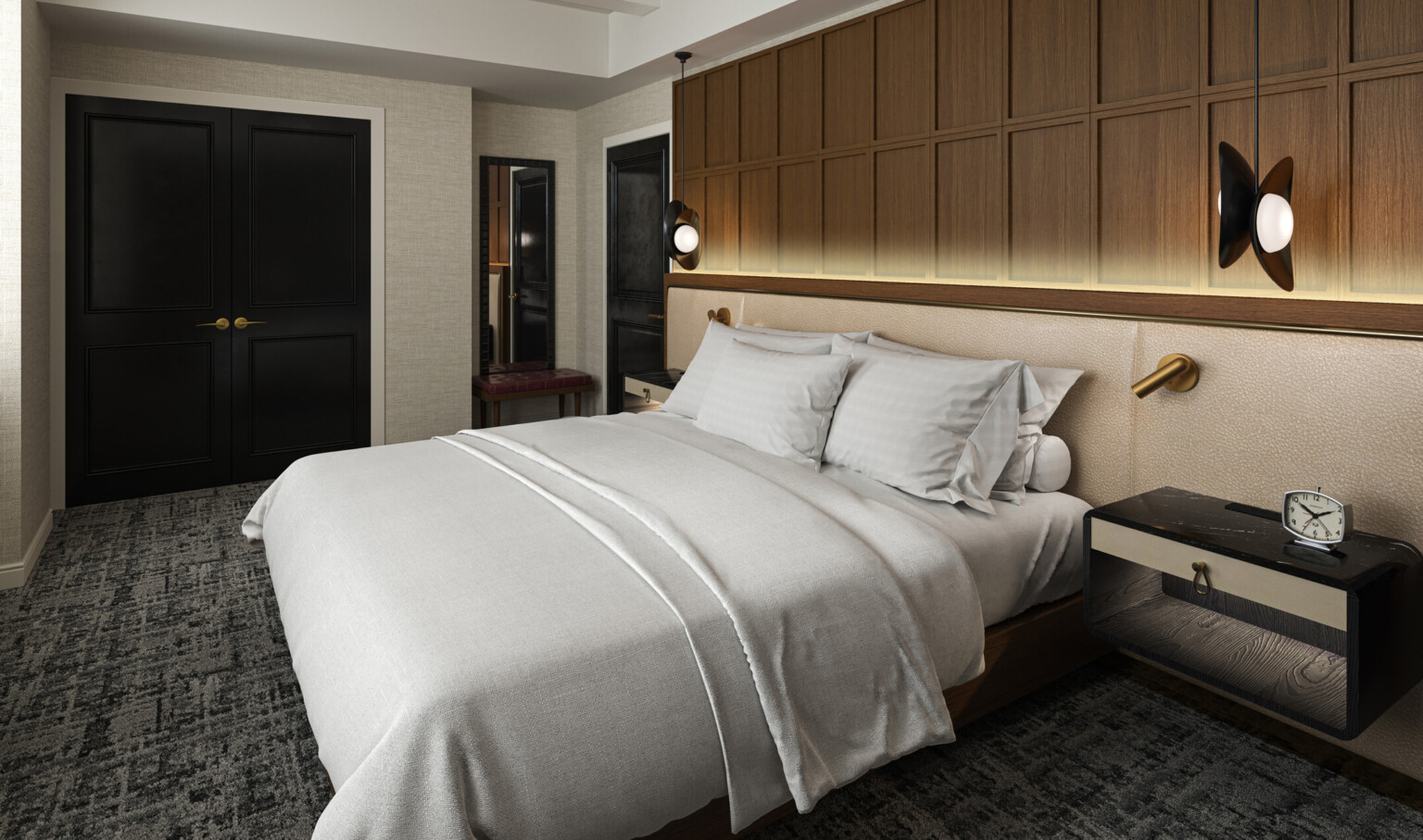 Modern hotel room with black doors, dark grey carpeting, white linens and brown wood accents