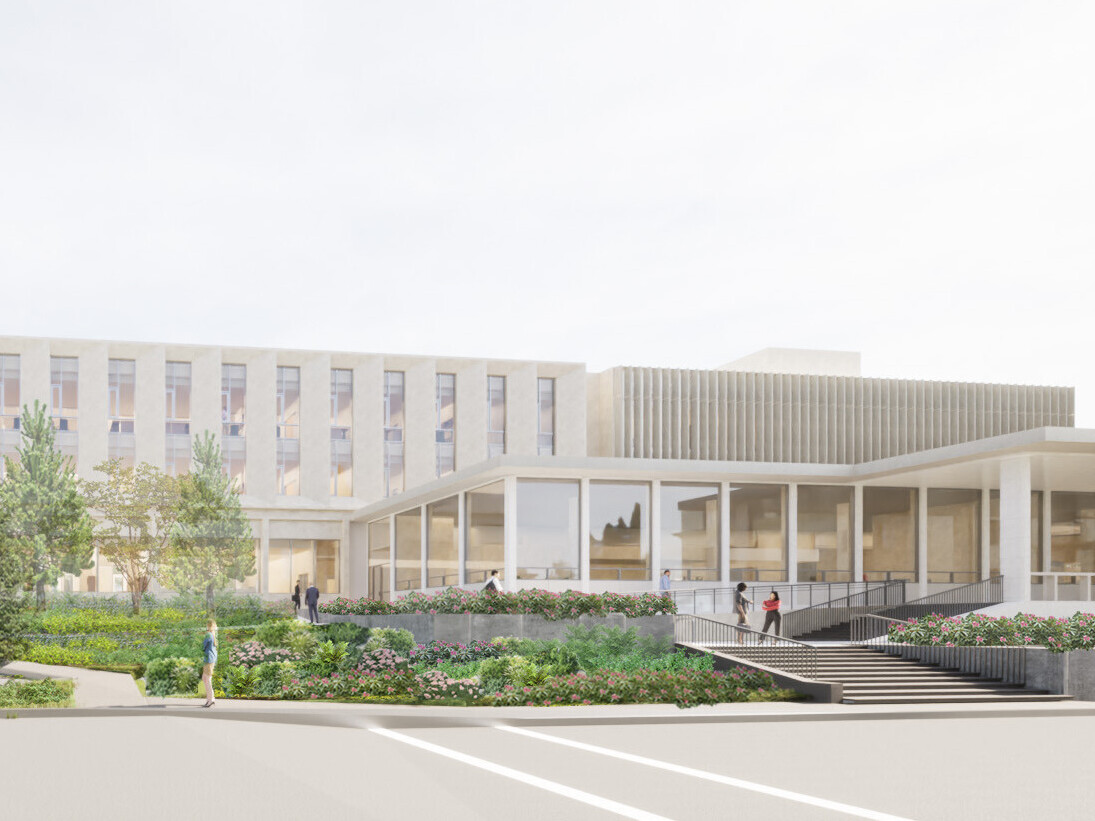 Rendering of a multistory office building with large glass atrium out front surrounded by trees and lush landscaping