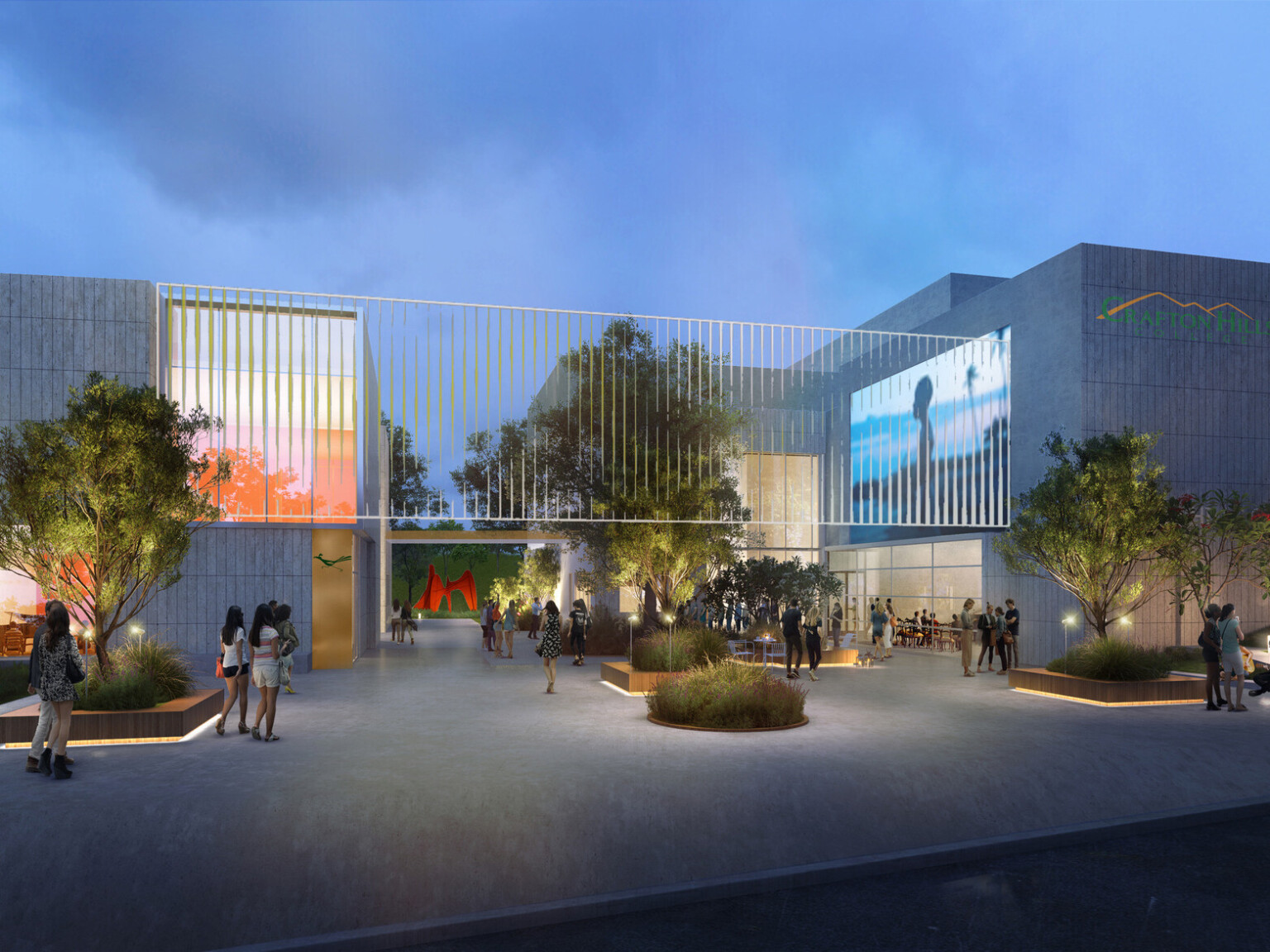 Rendering of the Crafton Hills College PAC showing two grey stone buildings connected with a railing with lush landscaping lit by lights