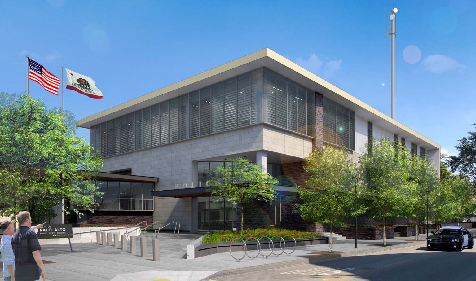 Palo Alto Public Safety Building canopied entrance to multi story light stone building, floor to ceiling windows on second floor, wrapped facade