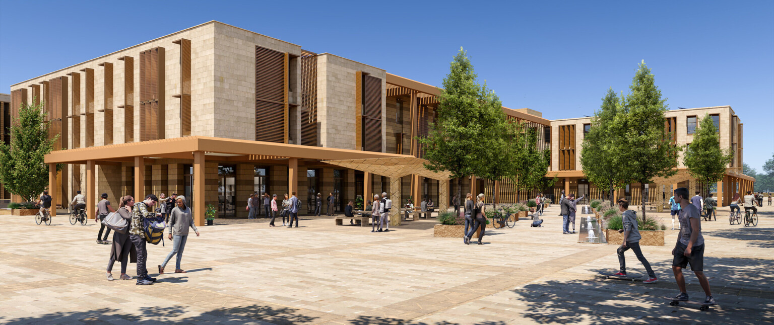An exterior render of a modern university campus building with large windows and wooden accents. In front of the building is a spacious plaza with neatly paved walkways and several trees providing shade
